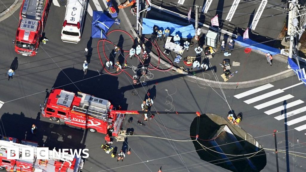 Sinkhole widens as rescuers try to save truck driver